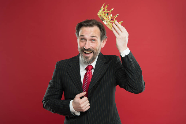 I am just superior. Become king ceremony. Award and achievement. Feeling superiority. Being superior human. Man bearded guy in suit hold golden crown symbol of monarchy. Superior and narcissistic - Photo, Image