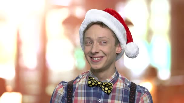 Funny teenage boy in Christmas hat. - Footage, Video