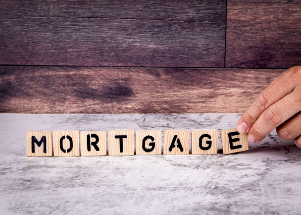 Mortgage. Word from wooden letters - Φωτογραφία, εικόνα