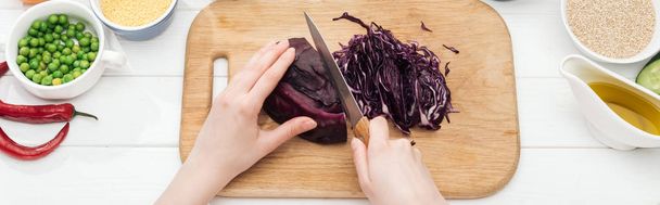 cropped view of woman cutting red cabbage on wooden chopping board, panoramic shot - Photo, Image