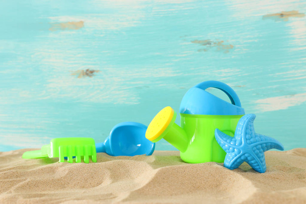 vacation and summer image with beach colorful toys for kid over the sand - Фото, зображення