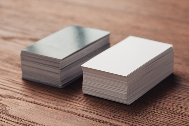 stacks of empty white and black business cards on wooden table - Photo, Image