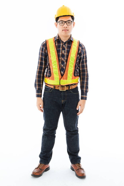 Engineer, Worker man with Mustache and beard look like Arabian in table striped shirt, black pants, yellow helmet and reflective vest, standing confident , portrait half body isolated on white - Photo, Image