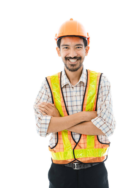 Ingeniero hombre cruz brazo naranja casco y chaleco
 - Foto, Imagen