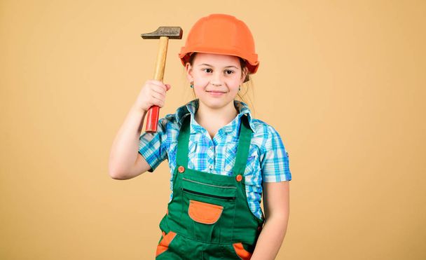 Build your future yourself. Initiative child girl hard hat helmet builder worker. Tools to improve yourself. Child care development. Builder engineer architect. Future profession. Kid builder girl - 写真・画像