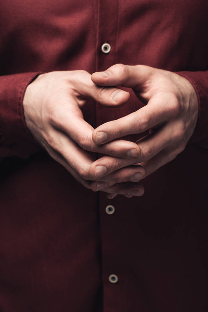 partial view of man gesturing with clenched hands, human emotion and expression concept - Photo, Image