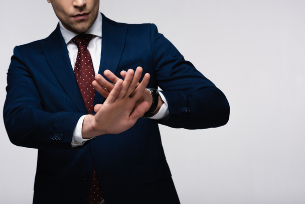 partial view of confident businessman showing refuse gesture isolated on grey, human emotion and expression concept - Photo, Image