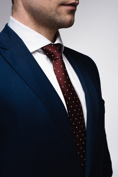 partial view of confident businessman in suit and tie isolated on grey - Fotoğraf, Görsel