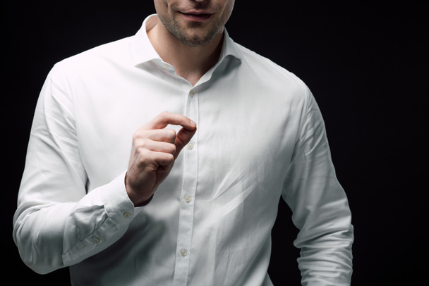cropped view of businessman gesturing with hand while using body language isolated on black, human emotion and expression concept - Photo, Image