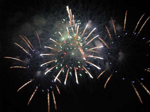 Fireworks, salute, a scattering of colored lights, for backgrounds - Photo, Image