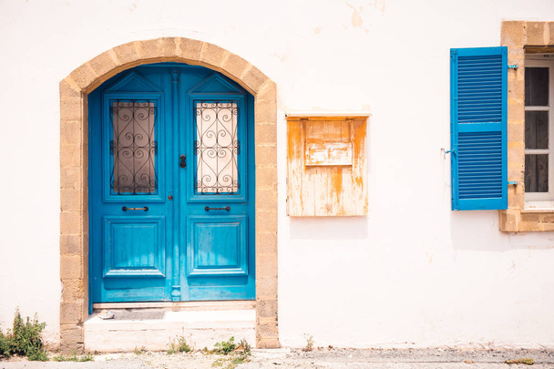 Blue door and colorful building in Paphos, Cyprus - Фото, зображення