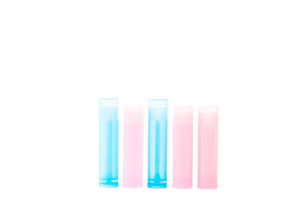 frascos de color rosa y azul con medicamentos aislados en blanco
  - Foto, imagen