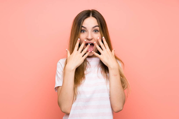 Young woman over isolated pink wall with surprise facial expression - Foto, Bild