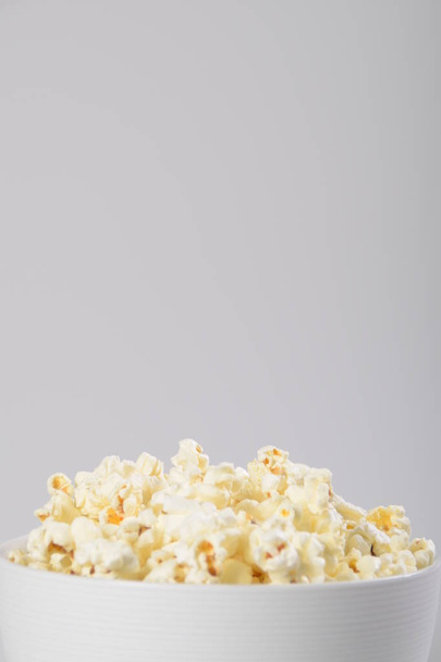 Close up Isolated Caramel popcorn in white bowl. - Фото, изображение