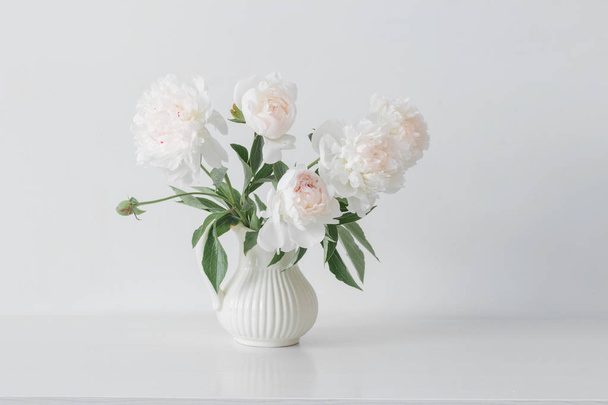 peonies flowers in vase on white background - Zdjęcie, obraz