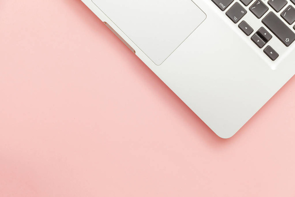 Keyboard laptop computer isolated on pink pastel desk background. Modern Information technology and sofware advances - Foto, Imagem