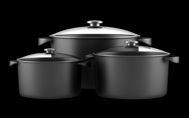 drie zwarte koken pannen geïsoleerd op zwarte achtergrond - Foto, afbeelding