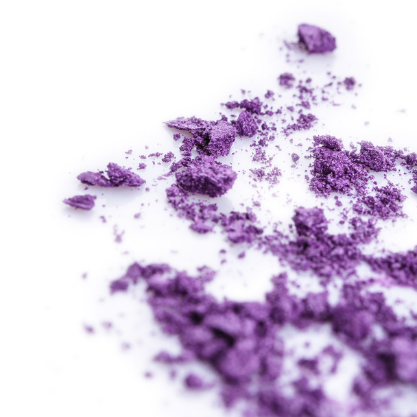 Crushed purple eye shadow on white background - Fotografie, Obrázek