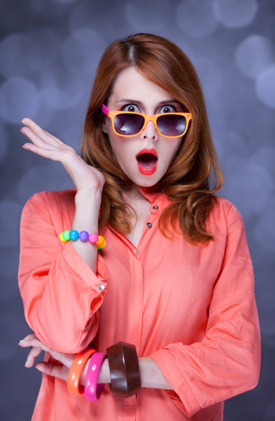 Surprised redhead girl in sunglasses - Foto, afbeelding