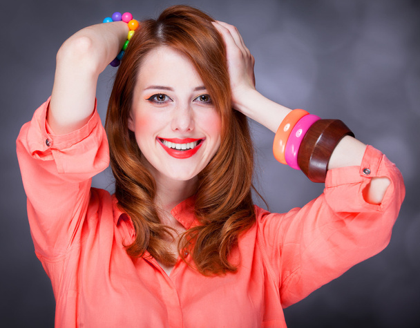 Beautiful red-haired girl at bokeh background - Foto, Bild