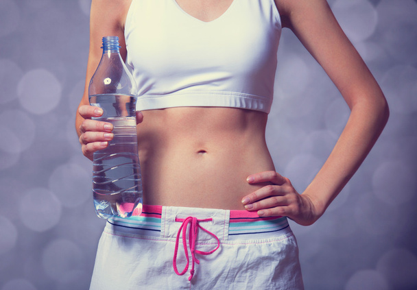 Sport woman with bottle. - Photo, image