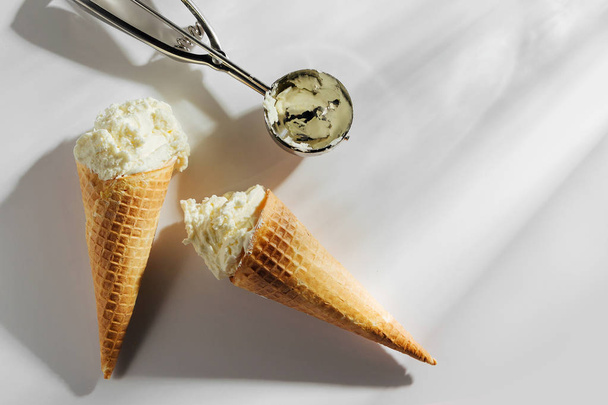 Ice cream cones with spoon on white background. Summer concept - Foto, imagen