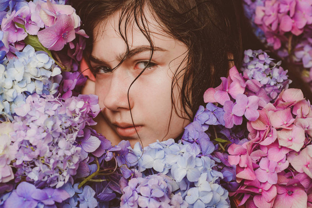 Summer beauty. Makeup cosmetics and skincare. Spring woman with hydrangea flowers. Fashion portrait of woman. Healthy hair and skin. girl with summer makeup. Spring in pot - Fotó, kép