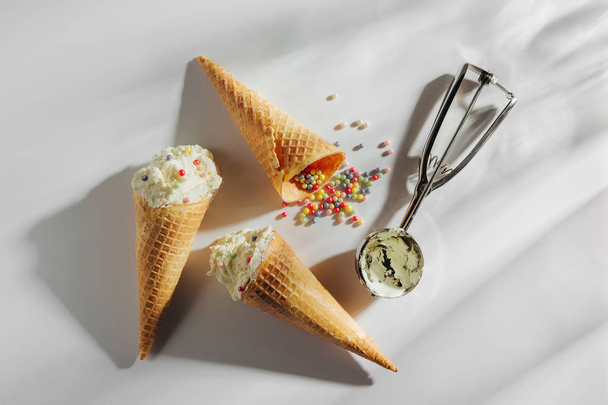 Ice cream cones with spoon on white background. Summer concept - Фото, зображення