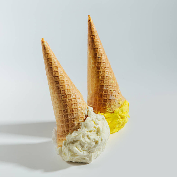 Ice cream cones fallen on white background.  - Fotografie, Obrázek