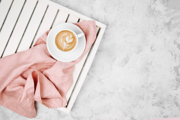 Cup of coffee on white wooden serving tray. Flat lay, top vie - Photo, image