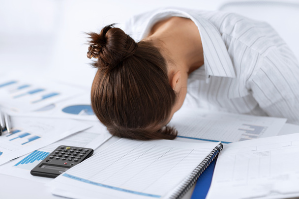 Woman sleeping at work in funny pose - Photo, Image
