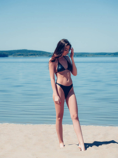 young teen girl in swimsuit on the beach - Фото, зображення