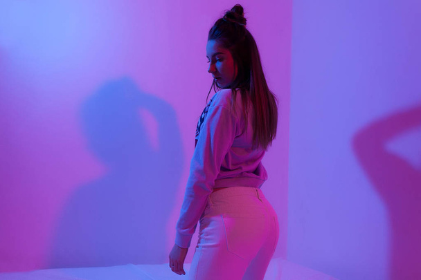 photo of girl in pink purple light rap style - Foto, imagen