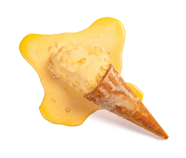 top view mango flavor ice cream cone in a melting process on white with clipping path - Photo, Image