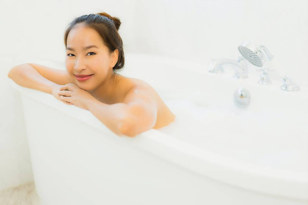 Portrait beautiful young asian woman take a bathtub in bathroom - Photo, Image