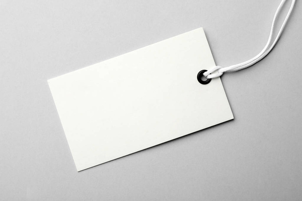 Cardboard tag with space for text on light background, top view - Foto, immagini