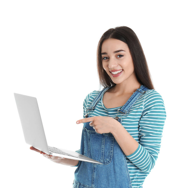 Portrait of young woman in casual outfit with laptop on white background - Foto, Imagem