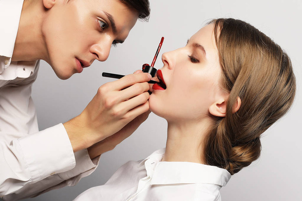  Young beautiful   woman applying make-up by make-up artist - Φωτογραφία, εικόνα