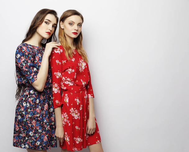 lifestyle, fashion and people concept - two stylish sexy girls best friends. - Foto, Imagem