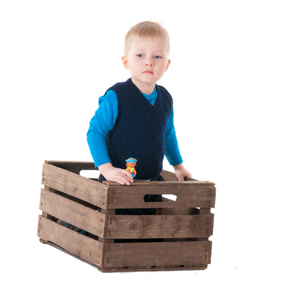 Little boy in wooden box - Foto, Imagem