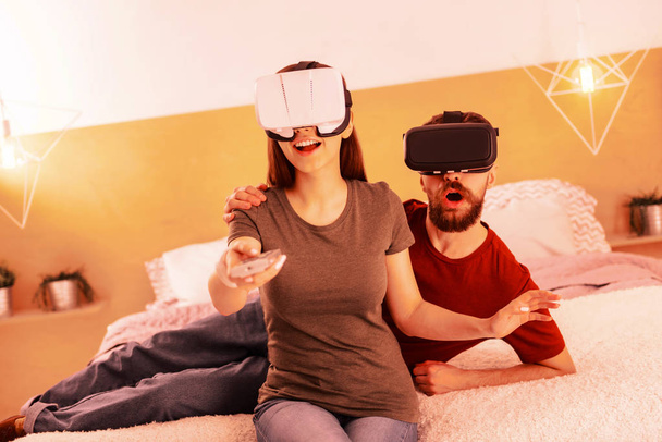 Sweet couple playing virtual reality at home - Fotografie, Obrázek