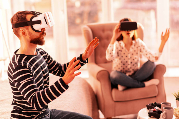 Cute couple enjoying a virtual game together - Foto, Bild