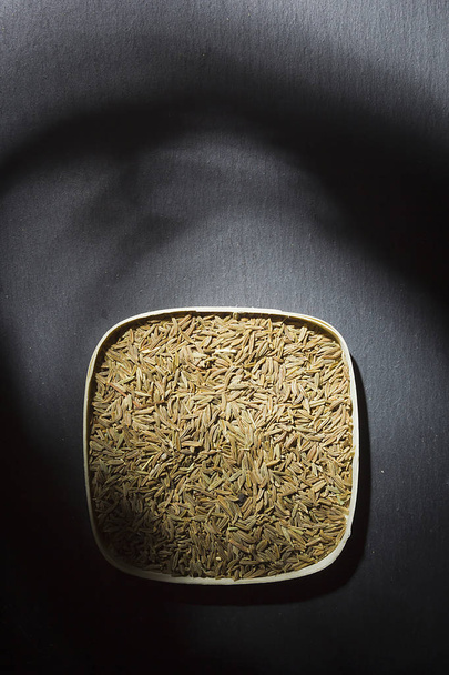 Cumin seeds in a box - Фото, зображення