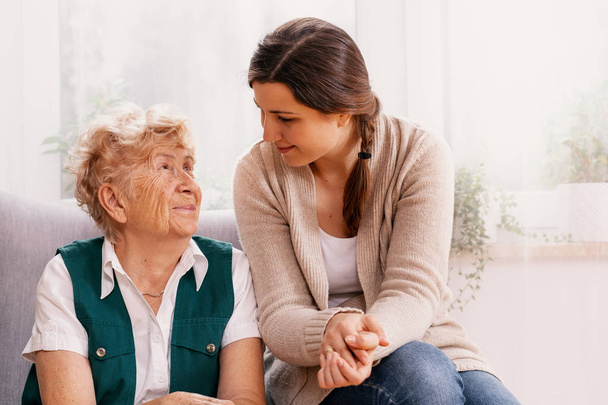 Senior woman and helpful volunteer at nursing home - Photo, Image