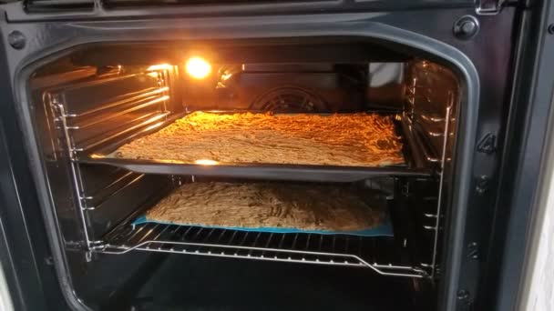 Open oven's door and cake inside. 4k video - Footage, Video