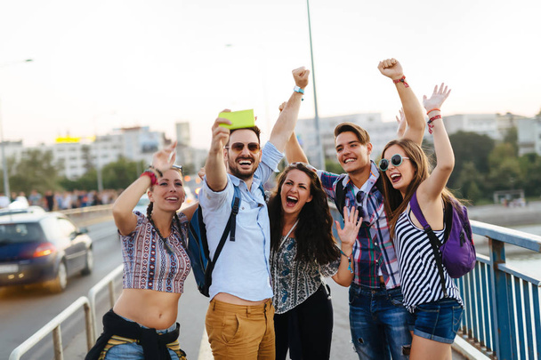 Happy young friends taking group selfie on street - Fotografie, Obrázek