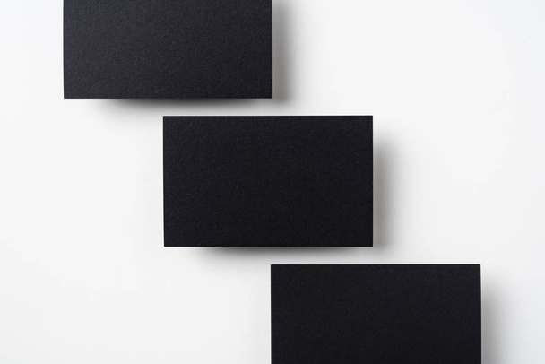 Black business cards isolated on white background for mockup - Valokuva, kuva