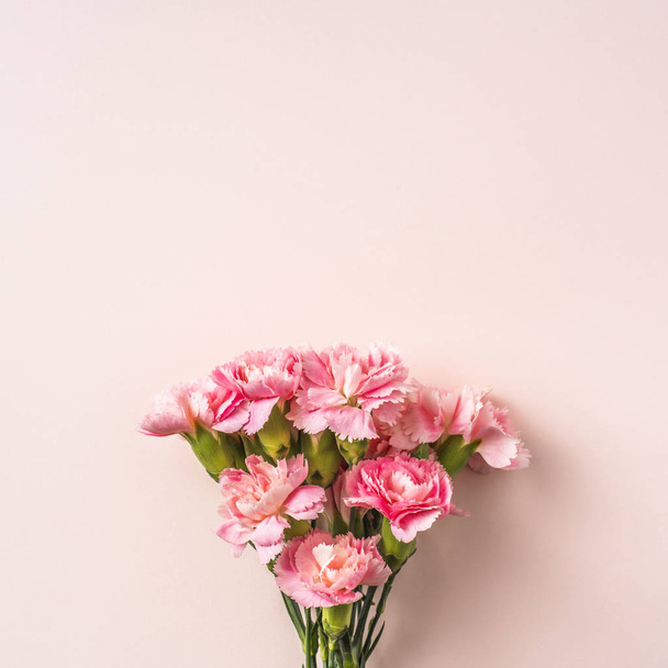 Top view bunch of carnations flowers on pink background - Photo, Image