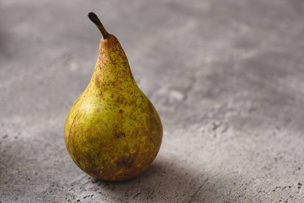Organic Pear on Dark Stone Background. Healthy Eating Concept with Copy Space. - Фото, изображение