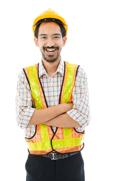Engineer man cross arm orange helmet and vest - Photo, Image